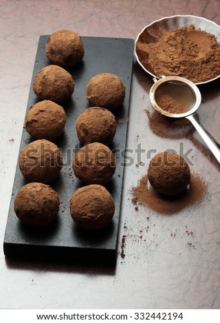 Truffle chocolate candies /  cocoa powder/ Making chocolate truffles