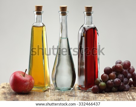Apple cider vinegar, grapes vinegar and ordinary vinegar isolated on white background
