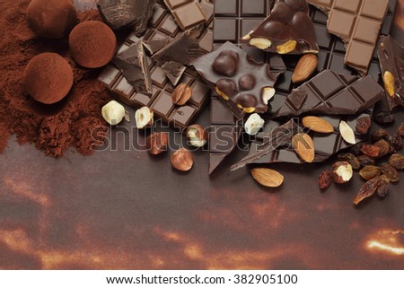 Chocolate background/ nut chocolate/ chocolate bar/ chocolate truffle/ hazelnut