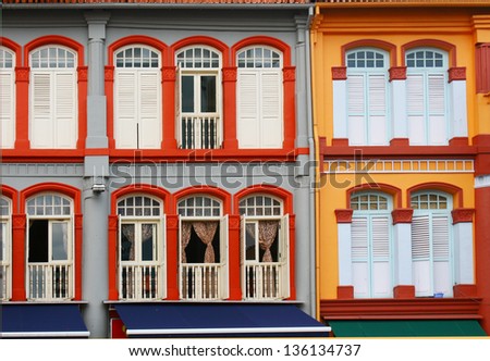 colorful windows facade, public urban street design, old shophouse at china town singapore