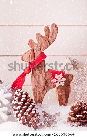 wooden elk christmas decoration with snow