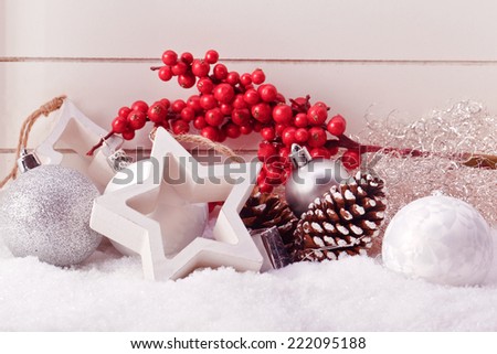 white star and christmas ball decoration with red berries