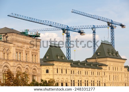 MOSCOW - JULY 29: Building cranes and GUM store building on Red Square on July 29, 2014 in Moscow.