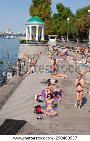 MOSCOW - JULY 31: People relaxing at Olive Beach in Gorky Park on July 31, 2014 in Moscow. Olive Beach is located on the bank of Moskva River.