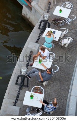 MOSCOW - JULY 31: People sitting at tables on Moskva river beach on July 31, 2014 in Moscow.
