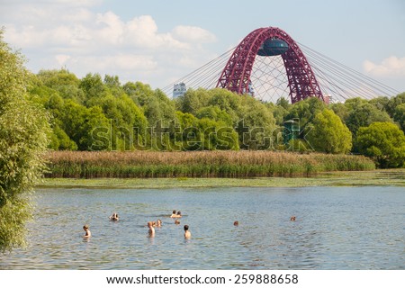 MOSCOW - AUGUST 03: People swimming in Moskva river in Serebryany Bor on August 3, 2014 in Moscow. Serebryany Bor is the large forest park in North-west Moscow.