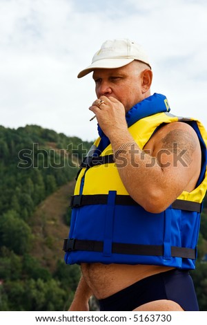 The kind rescuer in a life jacket 
