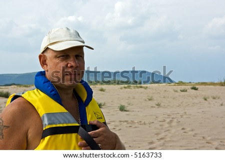The kind rescuer in a life jacket
