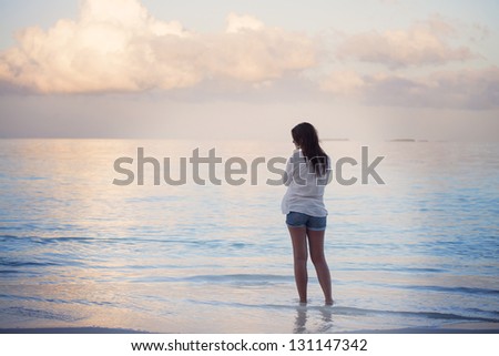 Young woman watching the sea in Maldives