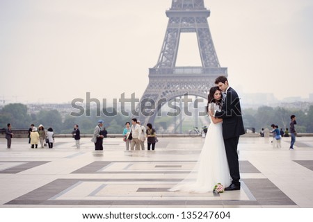 Happy bride and groom enjoying their wedding in Paris