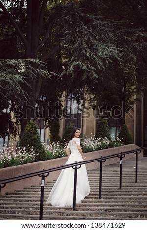 Beautiful delicate bride enjoying her wedding day in Paris