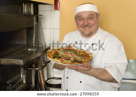 A man makes pizza