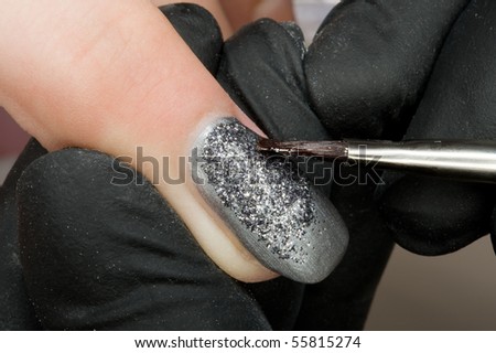 A nail designer at work
