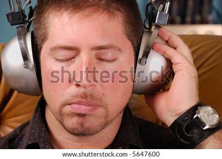 stylish man with goatee and vintage headphones