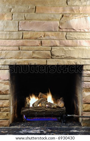 Fireplace with modern stone and gas logs