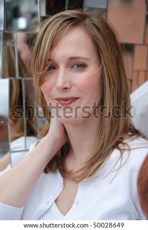 smiling woman with reflection in mirrors