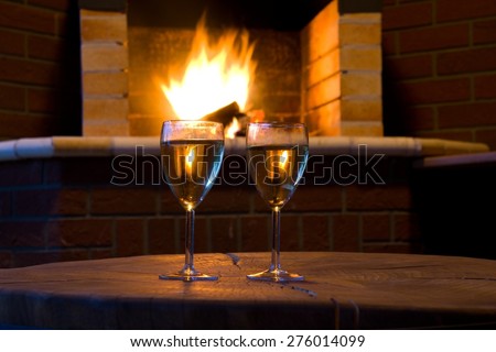 A relaxing evening - glass of wine fireside