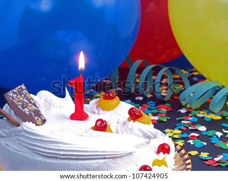Birthday-anniversary cake with red candle showing Nr. 1