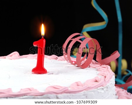 Birthday-anniversary cake with red candle showing Nr. 1