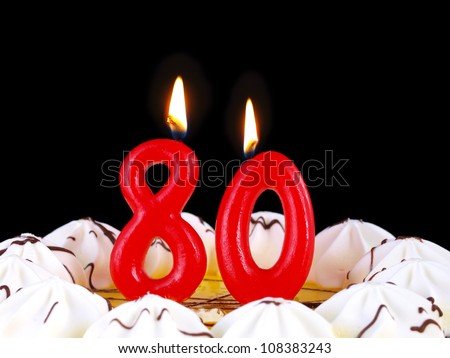 Birthday-anniversary cake with red candles showing Nr. 80
