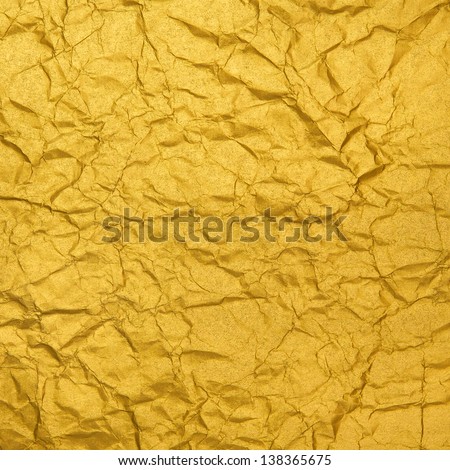 The crumpled leaf of gold paper