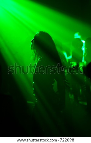 dancing man with a striking profile in an underground club