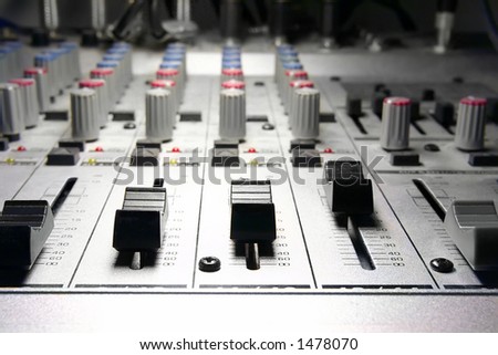 recording studio/mixer illuminated by a studio-spot