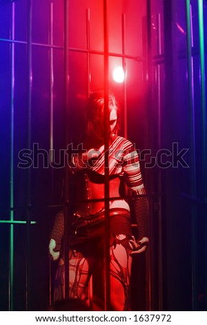 dancing woman in a steel cage