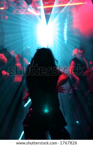 silhouette of dancing woman in a disco