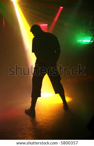 silhouette of dancing man in a disco