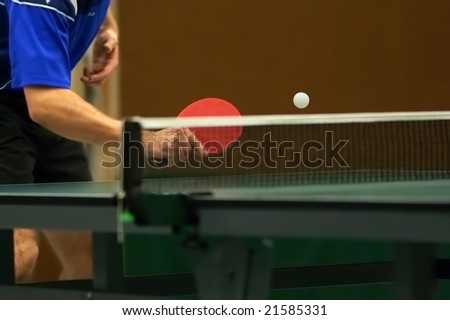 table tennis player returning ball, focus at the ball!