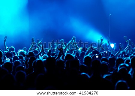 Motion Blur version of clapping hands/cheering crowd at concert