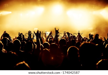 Silhouettes Of Concert Crowd In Front Of Bright Stage Lights
