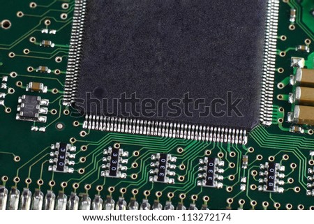 Computer hardware closeup. Hard disk controller on the circuit board macro