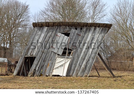 stock-photo-ramshackle-wooden-barn-tilted-to-the-side-137267405.jpg