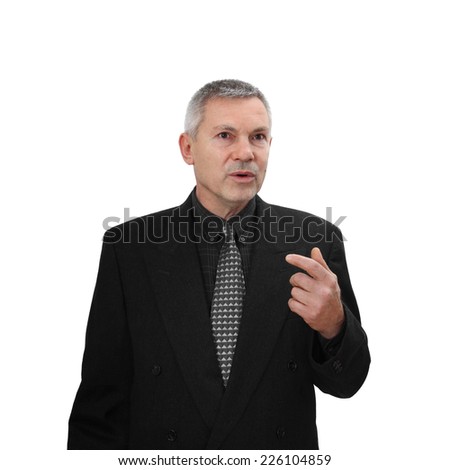 Middle age man in business classic black suit speaks gesturing isolated on white background