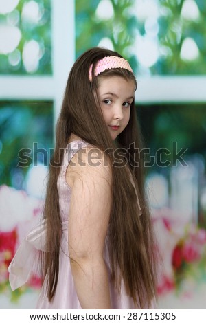 Cute long haired plump round faced girl portrait