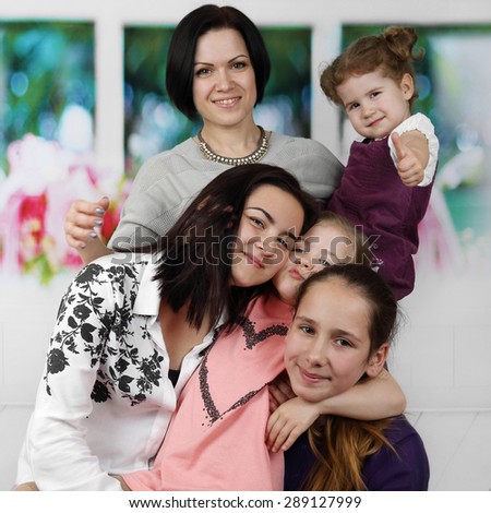 Mother with four all ages daughters portrait - Big family and parenting concept