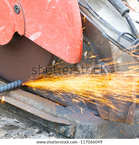 cutting steel rod by machine on a day at the construction site