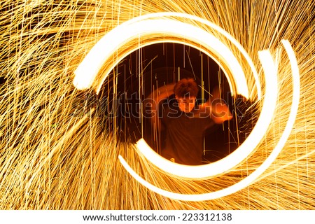 Rayong, Thailand - October, 13, 2014 : steel wool spinning in amazing fire show on the beach at night on October, 13, 2014 at Samed Island, Rayong, Thailand.