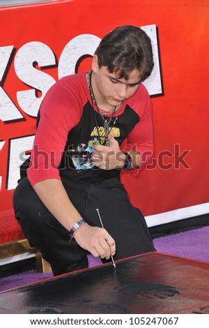 LOS ANGELES, CA - JANUARY 26, 2012: Michael Jackson\'s son Prince Michael Jackson placing his father\'s glove & shoe-prints in cement at the Chinese Theatre. January 26, 2012  Los Angeles, CA