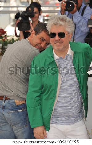 CANNES, FRANCE - MAY 19, 2011: Antonio Banderas & director Pedro Almodovar at the photocall for \