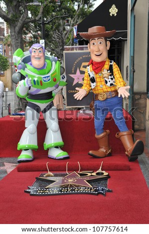LOS ANGELES, CA - JUNE 2, 2010: Toy Story stars Buzz Lightyear (left) & Woody on Hollywood Boulevard where composer Randy Newman was honored today with a star on the Hollywood Walk of Fame.