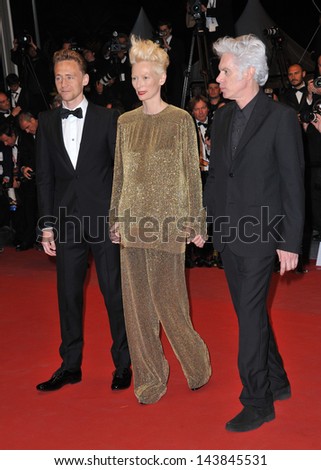 CANNES, FRANCE - MAY 25, 2013: Tom Hiddleston, Tilda Swinton & director Jim Jarmusch at gala premiere at the 66th Festival de Cannes for their movie \