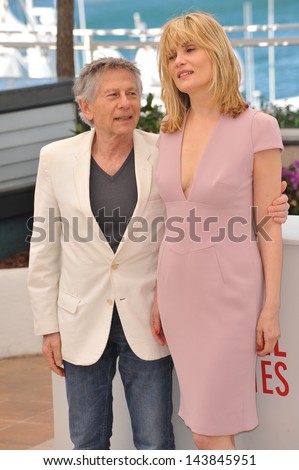 CANNES, FRANCE - MAY 25, 2013: Director Roman Polanski & wife actress Emmanuelle Seigner at the photocall for their movie 