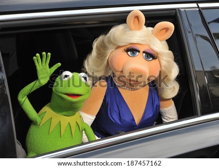 LOS ANGELES, CA - MARCH 11, 2014: Muppets\' characters Kermit the Frog & Miss Piggy at the world premiere of their movie Disney\'s \