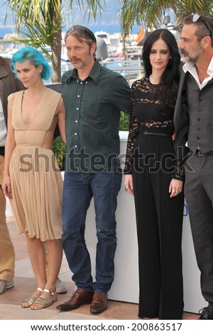 CANNES, FRANCE - MAY 17, 2014: Eva Green, Nanna Oland Fabricius, Mads Mikkelsen (left) & Jeffrey Dean Morgan at photo call for their movie \