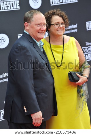 LOS ANGELES, CA - JULY 15, 2014: Executive producer John Lasseter & wife Nancy at the world premiere of his movie Disney's 