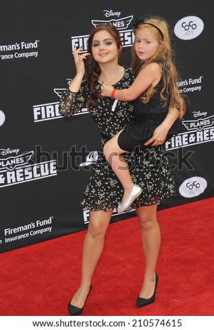 LOS ANGELES, CA - JULY 15, 2014: Ariel Winter & niece at the world premiere of Disney\'s \