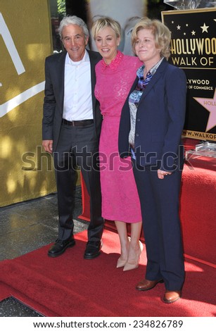 LOS ANGELES, CA - OCTOBER 29, 2014: Actress Kaley Cuoco with her parents on Hollywood Boulevard where she was honored with the 2,532nd star on the Hollywood Walk of Fame.